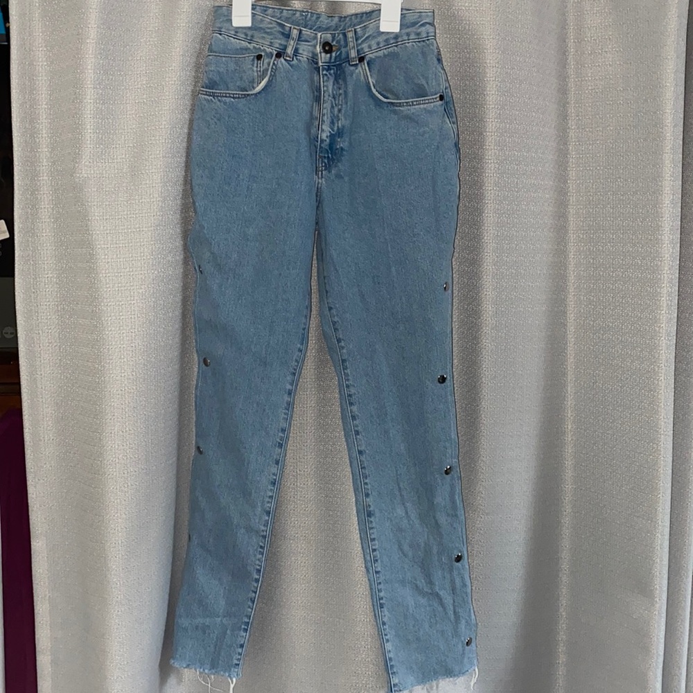 The ragged priest light wash jeans with functional accent buttons up the side